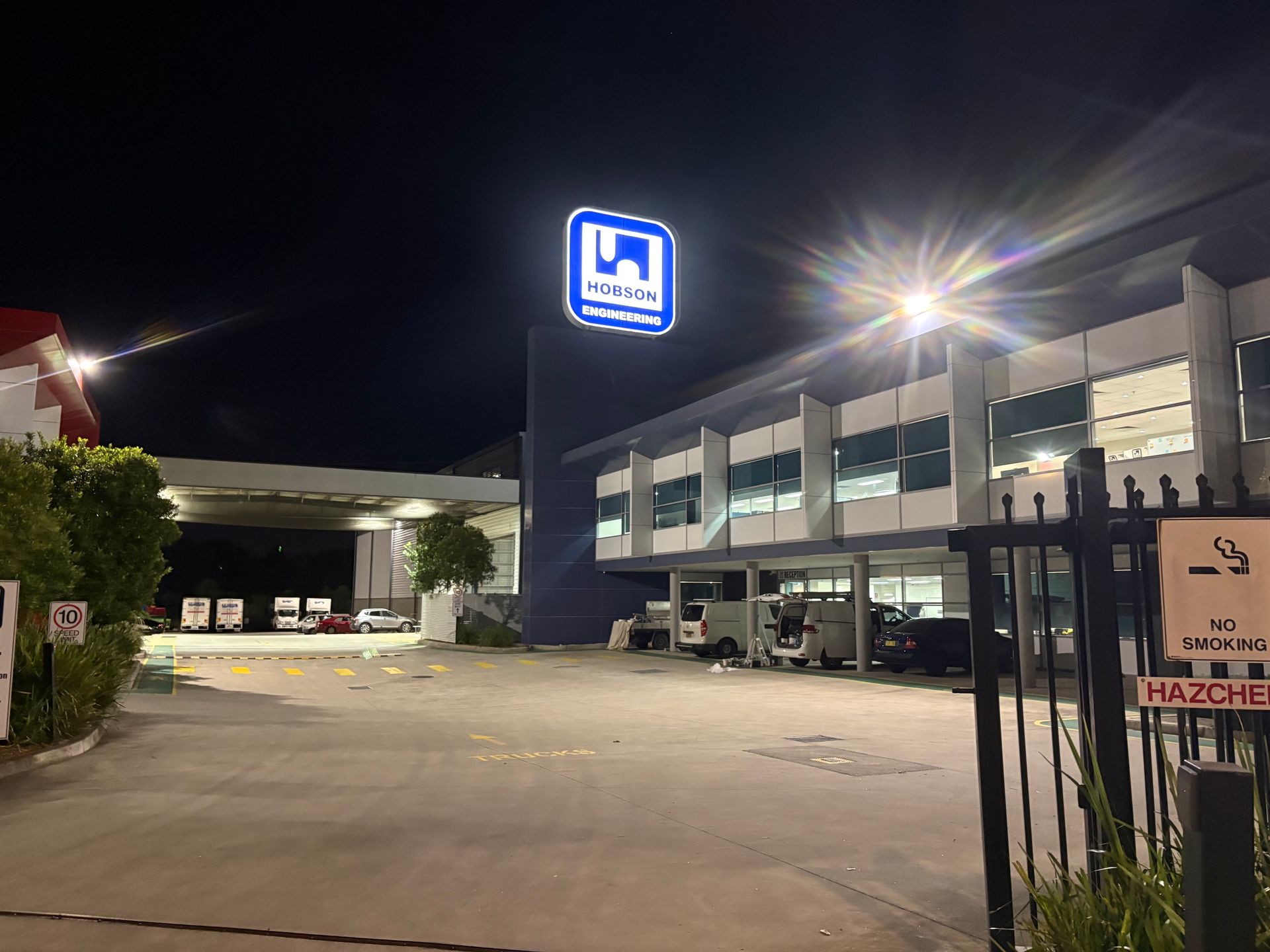 After-hours painting works at a commercial site at night