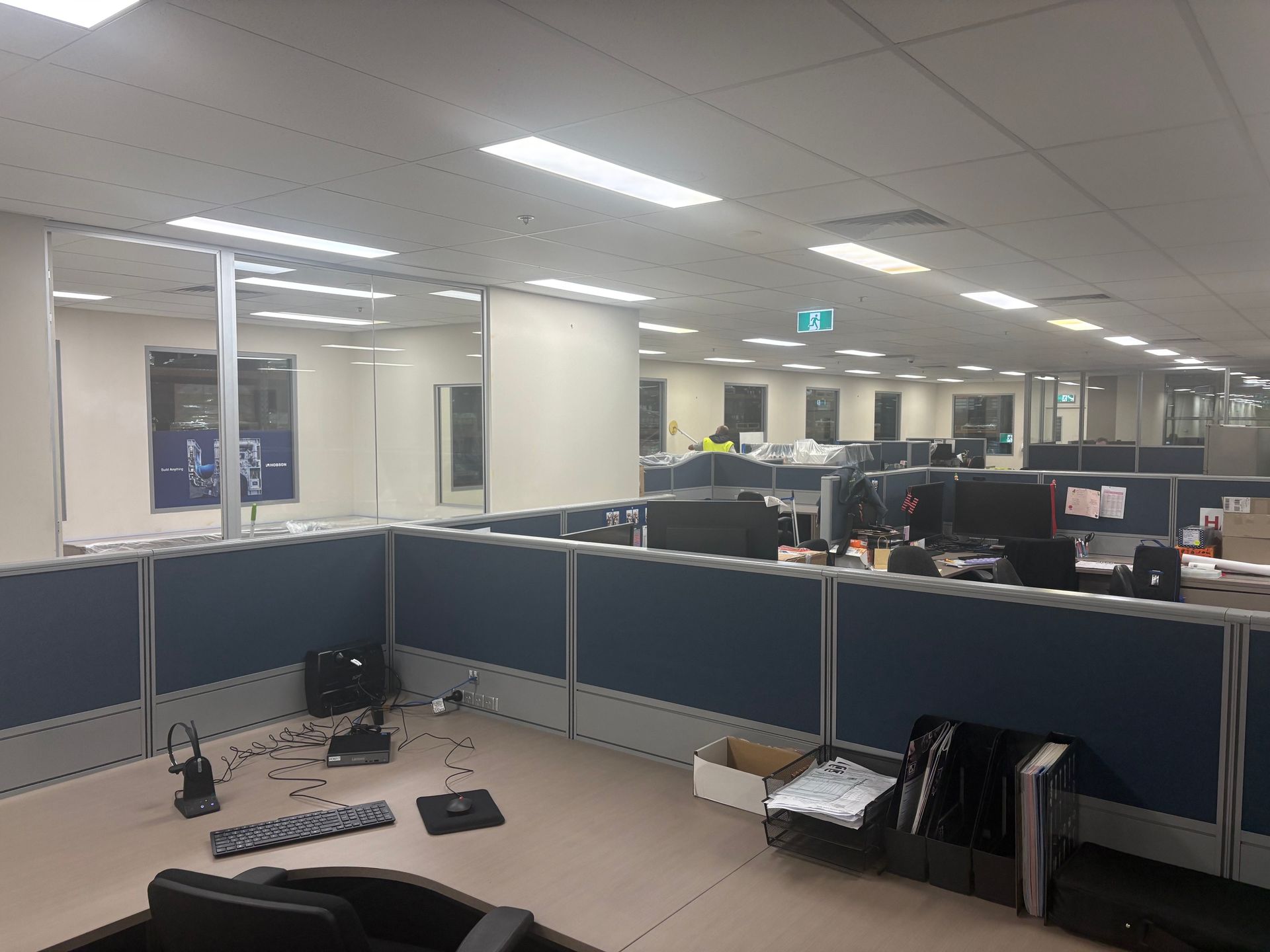 Open-plan office cubicles after a full repaint