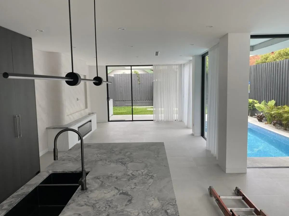 Modern open-plan living and kitchen area after an interior repaint