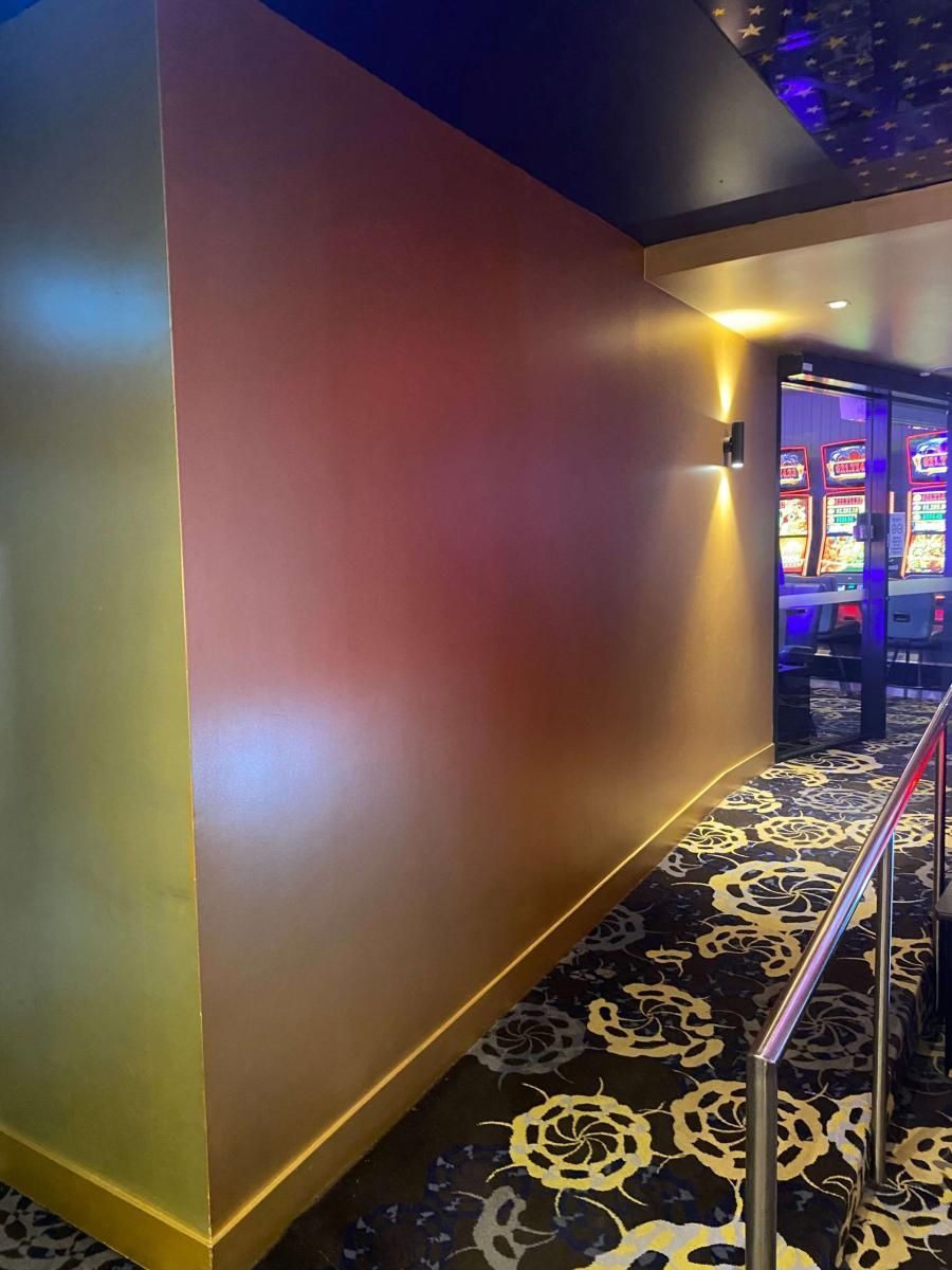 Painted feature wall beside the poker machine room at Mosman RSL Club