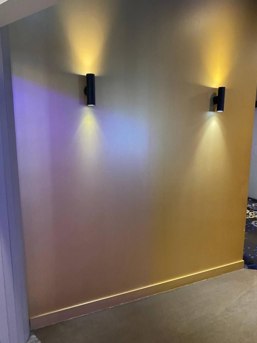 Painted feature wall with wall lights inside Mosman RSL Club