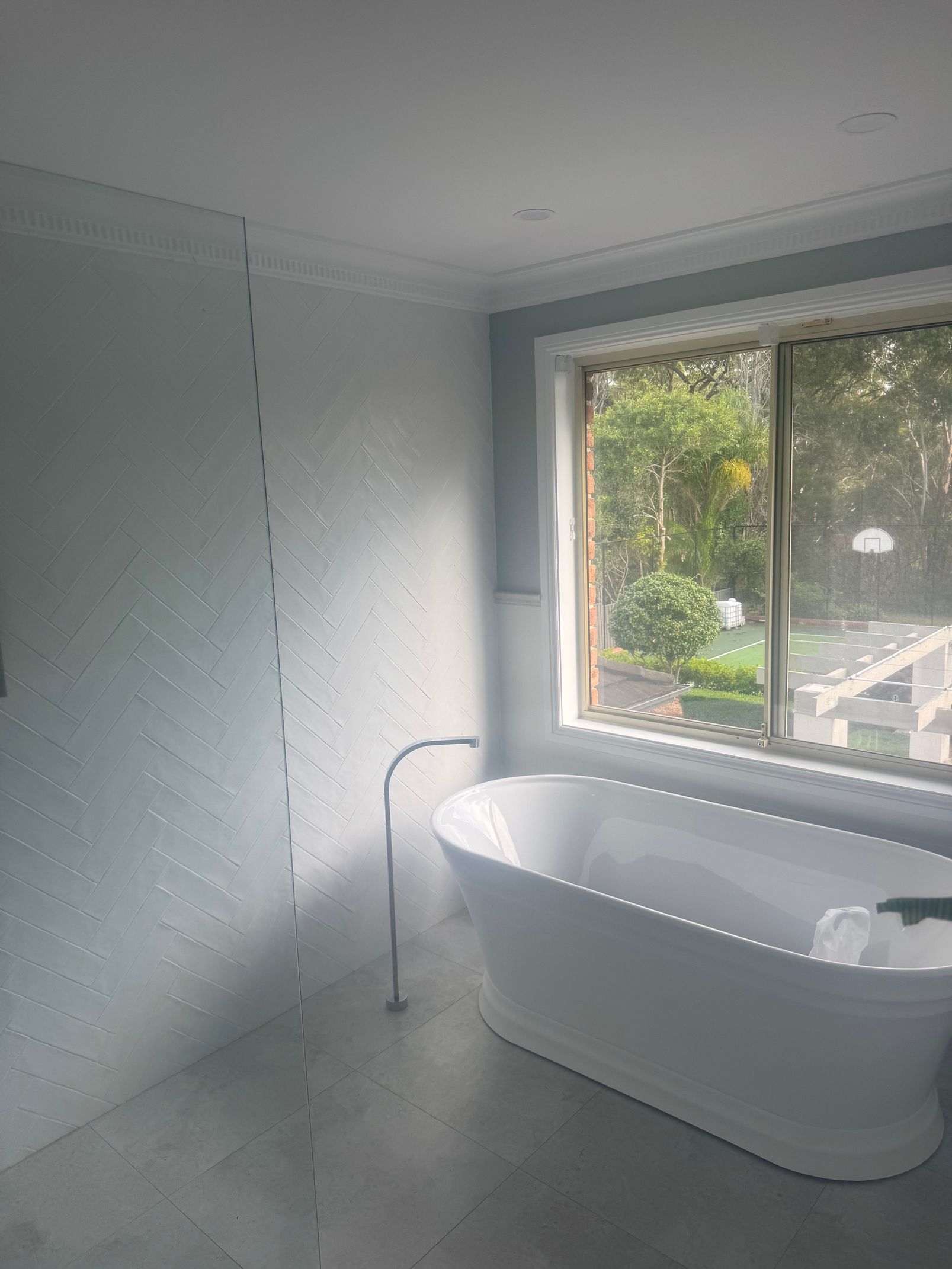 Repainted bathroom with a painted window frame